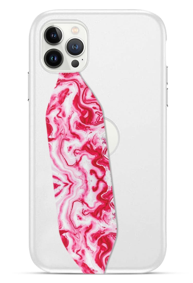 Switchbands reversible phone grip strap – Acetate Pink design. This playful, stylish grip features a vibrant 3D pattern with bold pink accents and a glossy finish. It provides a secure, comfortable grip for your phone, making it easier to hold while adding a fun and fashionable touch. The reversible design offers versatility, allowing you to switch up your look whenever you like. Perfect for those who love bold colors and modern, sleek accessories.