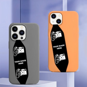 May include: Two phone cases with a black and white camera design. The text "Your Image Here" is printed on each case. One case is gray and the other is orange.