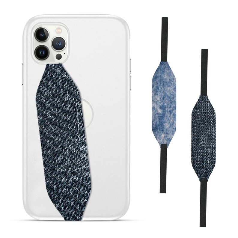 Switchbands reversible phone grip strap – Denim Indigo design. Features a sleek 3D pattern inspired by classic denim with rich indigo hues and textured details. Provides a secure, comfortable grip for your phone while adding a timeless, stylish touch. The reversible design offers versatility, making it easy to switch up your look. Perfect for those who appreciate a modern, casual aesthetic with a touch of sophistication.