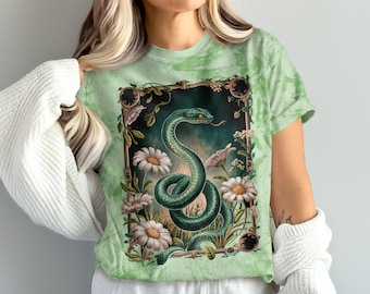 T-shirt med ormdesign, konstnärlig ormgrafik, botanisk illustration, naturinspirerad t-shirt, orm- och blomt-t-shirt