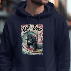 Kaiju Surf Hoodie, Surfing Monster Sweatshirt, Vintage Kaiju Style Pullover, Japanese Monster Surf Art, Retro Graphic Hoodie