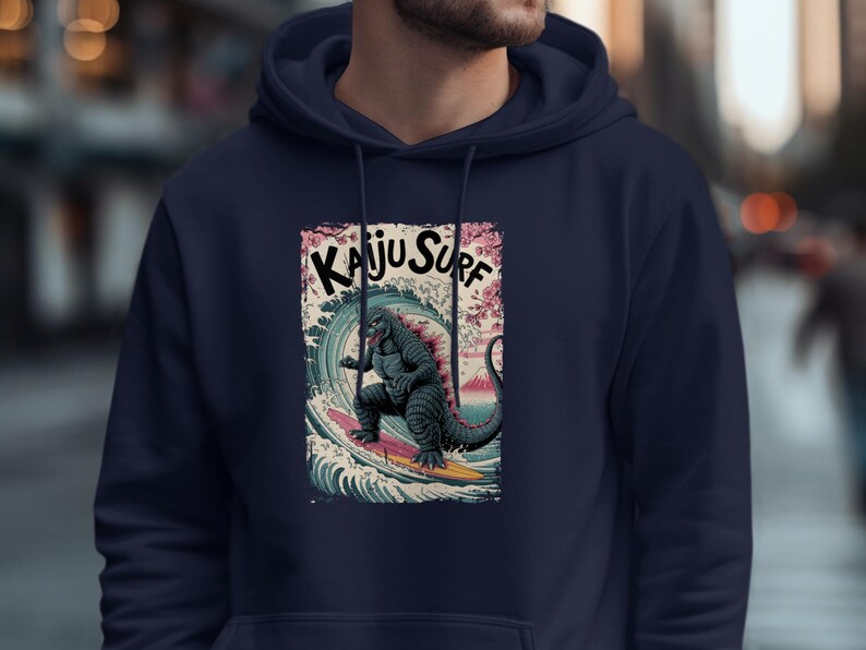 Kaiju Surf Hoodie, Surfing Monster Sweatshirt, Vintage Kaiju Style Pullover, Japanese Monster Surf Art, Retro Graphic Hoodie