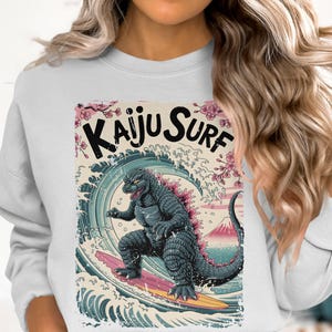 Kaiju Surf Sweatshirt, Surfing Monster Sweater, Retro Japanese Art Pullover, Cool Graphic Top, Unique Gift for Surf Enthusiasts