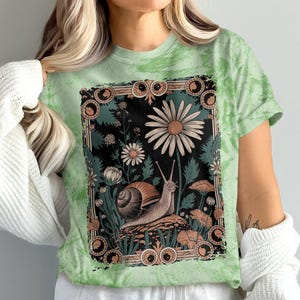 Garden Snail Art T-Shirt, Nature Inspired Graphic Tee, Cute Snail and Flowers, Boho Garden Shirt, Whimsical Floral Design Top
