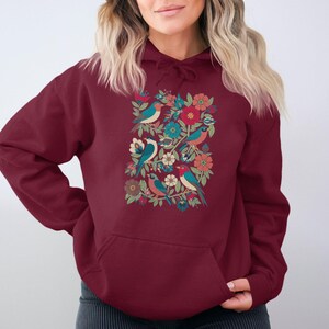 Cozy maroon hoodie, vibrant floral and bird pattern, perfect gift for her, stylish casual wear, comfortable and trendy design