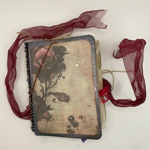 Mystical journal with hidden pockets, tuck spots, tags and more! Junk journal spellbook