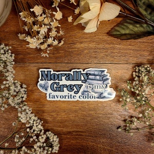 May include: A sticker with a stack of books and the text "Morally Grey is my favorite color".