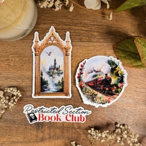 May include: Three stickers featuring scenes from the Harry Potter universe. The first sticker shows Hogwarts castle in the distance, framed by a golden archway. The second sticker shows the Hogwarts Express train steaming through a forest. The third sticker is a red and white logo that reads "Restricted Section Book Club".