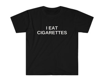 May include: Black t-shirt with white text that reads "I EAT CIGARETTES".