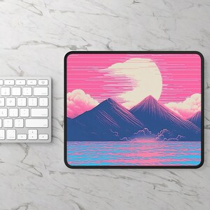 May include: A pink and blue mousepad with a mountain range and a large, white moon in the background. The mountains are silhouetted against the moon and the sky is a gradient of pink and blue.