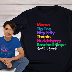 May include: Two blue t-shirts with the text "Mama Tip Top Fifty Fifty Thanks Huckleberry Baseball Player neuro squad" printed in rainbow colors.