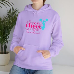 May include: A lavender hoodie with a pink and blue graphic that says "cheer cheer cheer leaders".