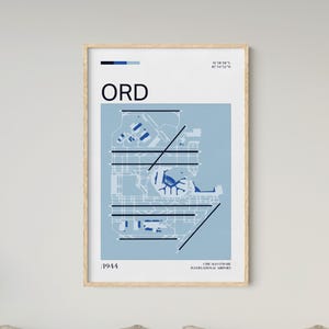 May include: A framed print featuring a stylized map of Chicago O'Hare International Airport (ORD) in shades of blue and white. The print includes the airport's layout, the year 1944, and the airport's name. The print is in a wooden frame.