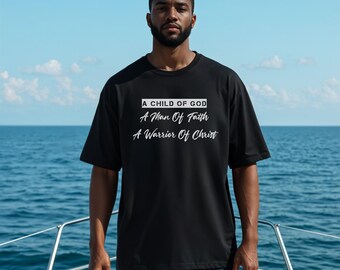 May include: Black t-shirt with white text: "A Child of God, A Man Of Faith, A Warrior Of Christ." The shirt is worn by a person on a boat with a blue ocean background. The shirt is a short-sleeved, crew neck style.