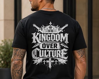 May include: A black short-sleeve t-shirt featuring a white graphic print on the back. The design includes a crown, two crossed swords, and the text "KINGDOM OVER CULTURE" in a distressed font, with a cross symbol positioned at the bottom.
