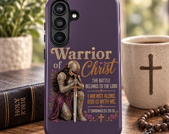 May include: A purple smartphone case featuring a graphic of a kneeling warrior in armor holding a sword. The text reads: Warrior of Christ, The battle belongs to the Lord, I am not alone, God is with me, 2 Chronicles 20:15, with floral accents.