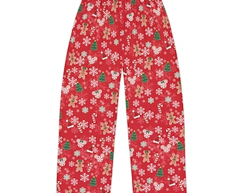 May include: Red pajama pants with a Christmas pattern featuring gingerbread men, candy canes, snowflakes, and Christmas trees.