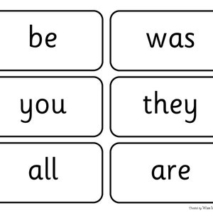 May include: Black and white flashcards with the words "be", "was", "you", "they", "all", and "are" printed on them.