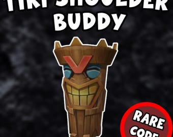 May include: A brown tiki statue with a smiling face and a red "V" on its forehead. The statue is wearing a blue headband and has a crown on its head. The text "TIKI SHOULDER BUDDY" is at the top of the image and "RARE CODE" is in a red circle at the bottom right.