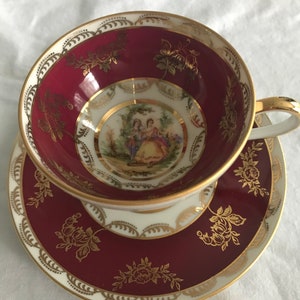 Vintage J.K. Carlsbad  burgundy and gold pedestal teacup and saucer