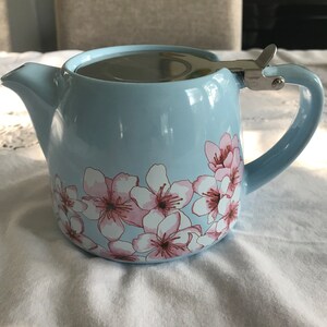 Vintage pale blue with pink cherry blossom design ceramic teapot , with stainless steel lid and loose leaf tea strainer