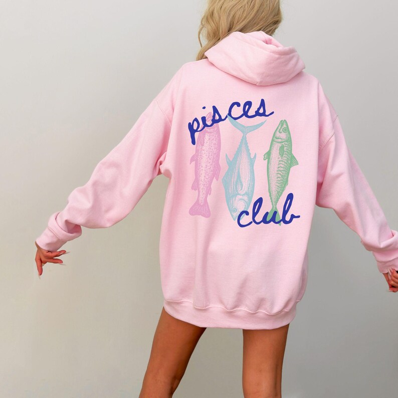 May include: Pink hoodie with a blue graphic of three fish and the text "pisces club" on the back.