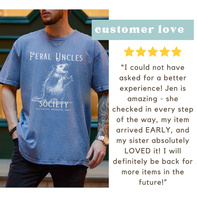 May include: A blue t-shirt with a white graphic of an opossum and the text "Feral Uncles Society Exclusive Members Only".
