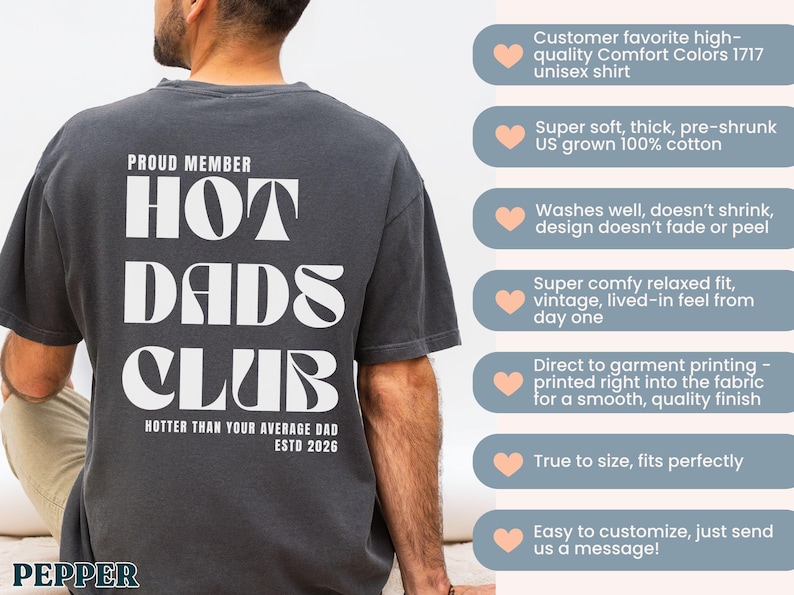 May include: Dark gray unisex t-shirt with the text "PROUD MEMBER HOT DADS CLUB" in white. The shirt also includes the phrase "HOTTER THAN YOUR AVERAGE DAD ESTD 2026". The shirt is made of 100% cotton.