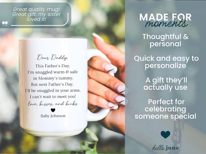May include: White ceramic mug with a handle, featuring a heartfelt message to "Daddy" for Father's Day, including a baby's message of love. The mug has a black heart and the name "Baby Johnson". The mug is held by a person.