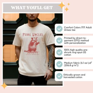 May include: A beige unisex t-shirt with a red illustration of a rat and the text "Feral Uncles Society Exclusive Members Only". The shirt is made of 100% high quality pre-shrunk ring-spun US cotton.