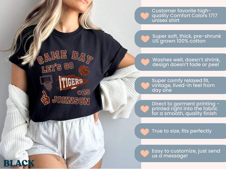 May include: Black unisex t-shirt with "GAME DAY" and "LET'S GO TIGERS" text, a basketball graphic, and the name "JOHNSON" with the number 25. The shirt is made of soft, pre-shrunk cotton.