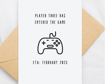 May include: A white card with black text that reads "Player Three Has Entered The Game" with a black and white illustration of a video game controller. The text "ETA: February 2025" is below the illustration.