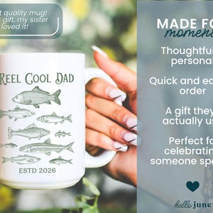 May include: White ceramic mug with the text "Reel Cool Dad" and illustrations of various fish. The mug also includes the text "ESTD 2026". The mug is held by a person with long nails. The mug is a gift for someone special.
