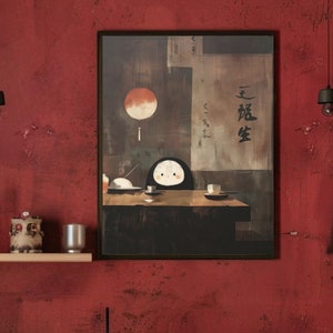 May include: A rustic kitchen with red cabinets and walls. A framed artwork with a Japanese theme hangs above the sink. A stainless steel kettle sits on the stovetop. The kitchen has a wooden table and a shelf with decorative items.