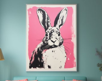Könnte beinhalten: Eine Schwarzweißillustration eines Kaninchens auf rosa Hintergrund. Das Kaninchen schaut direkt auf den Betrachter. Die Illustration ist gerahmt und hängt an einer Wand in einem Wohnzimmer.