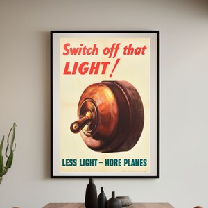 May include: Vintage World War II era poster with a red and white illustration of a light switch and the text "Switch off that LIGHT!" and "LESS LIGHT - MORE PLANES".