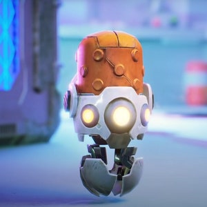 May include: A small, orange and white robot with glowing yellow eyes. The robot has a round, orange head with a textured surface and a white body with a round, white base.