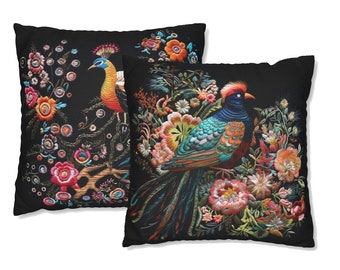 May include: Two black throw pillows with embroidered images of colorful peacocks and floral designs.