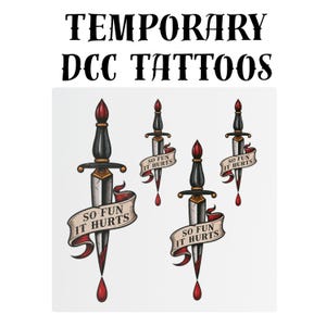 May include: A set of four temporary tattoos featuring black and silver daggers with red accents. Each dagger is wrapped in a beige banner with the text "SO FUN IT HURTS" in black letters. A red drop hangs from the tip of each dagger blade.