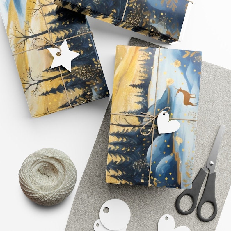 May include: Three wrapped presents featuring a winter woodland scene. The gifts are tied with twine and adorned with white paper stars and hearts. The presents are on a grey fabric surface with a reel of twine and white paper circles.