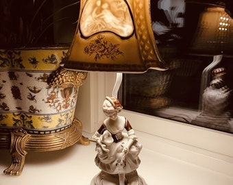 Porcelain Lamp Adorned with Beautiful Figurines and Intricate Porcelain Shade