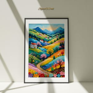 Può includere: Una stampa ad acquerello incorniciata raffigura un paesaggio vibrante con dolci colline, case e una strada tortuosa. L'opera presenta una tavolozza colorata di blu, verdi, gialli e rosa, creando una scena allegra. La cornice è nera.