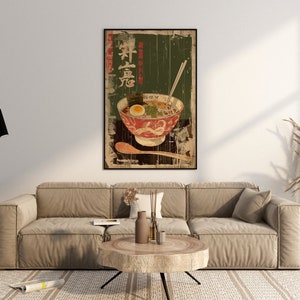 May include: A vintage-style poster featuring a bowl of ramen noodles with chopsticks and a spoon. The poster has a green background with Japanese text that reads "Ramen".
