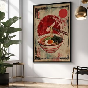 May include: A vintage-style poster featuring a bowl of ramen noodles with a red sun and Japanese text in the background.