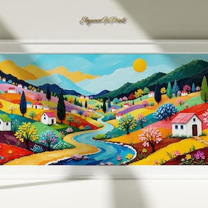 Può includere: Un vivace dipinto di paesaggio in una cornice bianca. L'opera raffigura una valle colorata con dolci colline, un fiume tortuoso e piccole case. Il cielo è blu con un sole giallo e la scena è piena di alberi e fiori.
