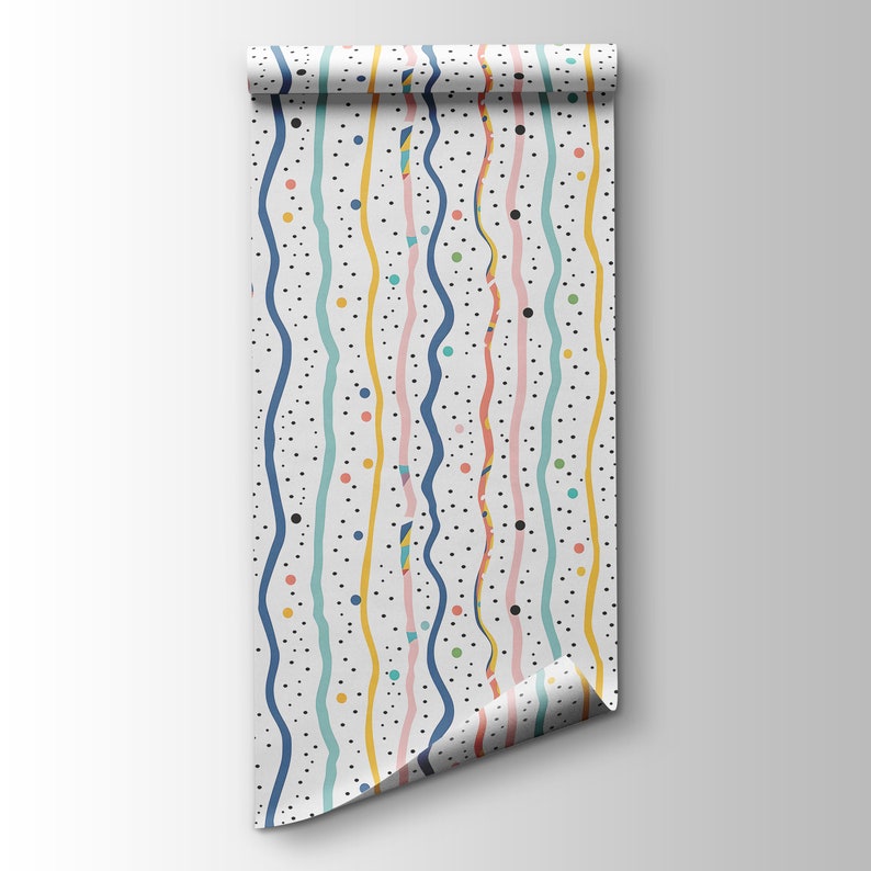 May include: A white wallpaper roll with a colorful pattern of wavy lines and dots. The lines are in shades of blue, pink, yellow, and green. The dots are black.