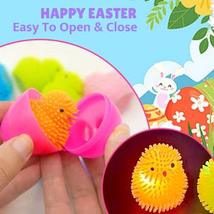May include: A pink plastic Easter egg is open, revealing an orange, spiky chick toy. The image includes the text "HAPPY EASTER Easy To Open & Close". Other eggs and Easter-themed graphics are in the background.