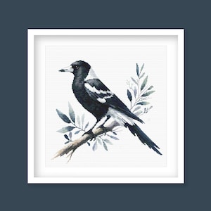 May include: A black and white magpie perched on a branch with blue watercolor leaves. The bird is facing to the right and has a white stripe on its head.