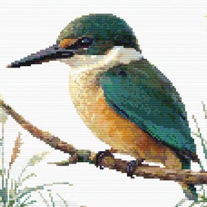 Close-up of Sacred Kingfisher Kōtare Cross Stitch Pattern showing the bird’s blue-green feathers, long beak, branch detail, and visible counted cross stitch texture.