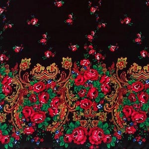 May include: Black fabric with a repeating pattern of red roses and gold paisley designs. The fabric has a border of larger red roses and gold paisley designs.